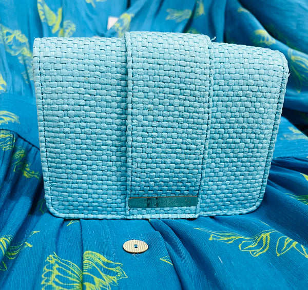 Clutch bag in royal aquamarine raffia